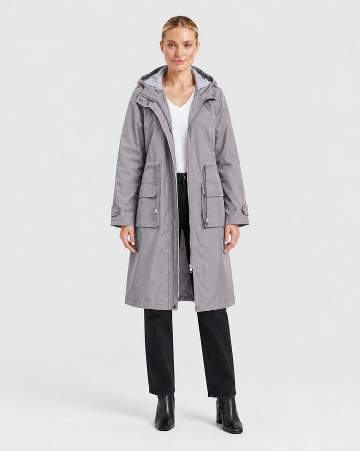 Luna Moda grey lightweight hooded trench coat with front pockets and adjustable features worn by a woman