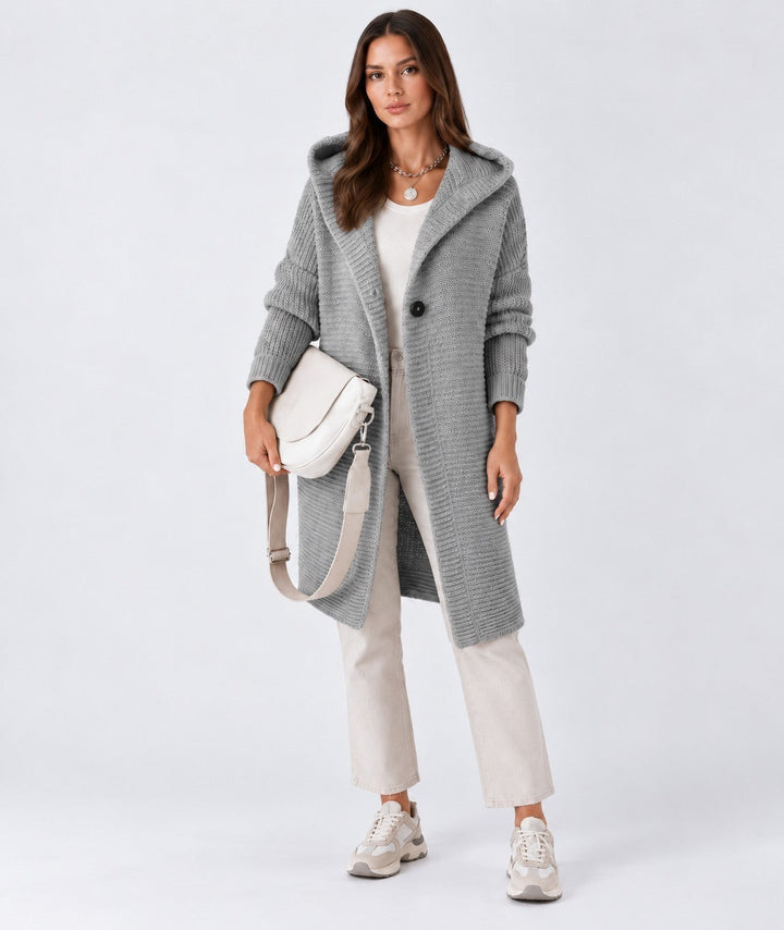 Luna Moda Elena grey long hooded cardigan with a single button closure worn by a model with beige pants and sneakers.