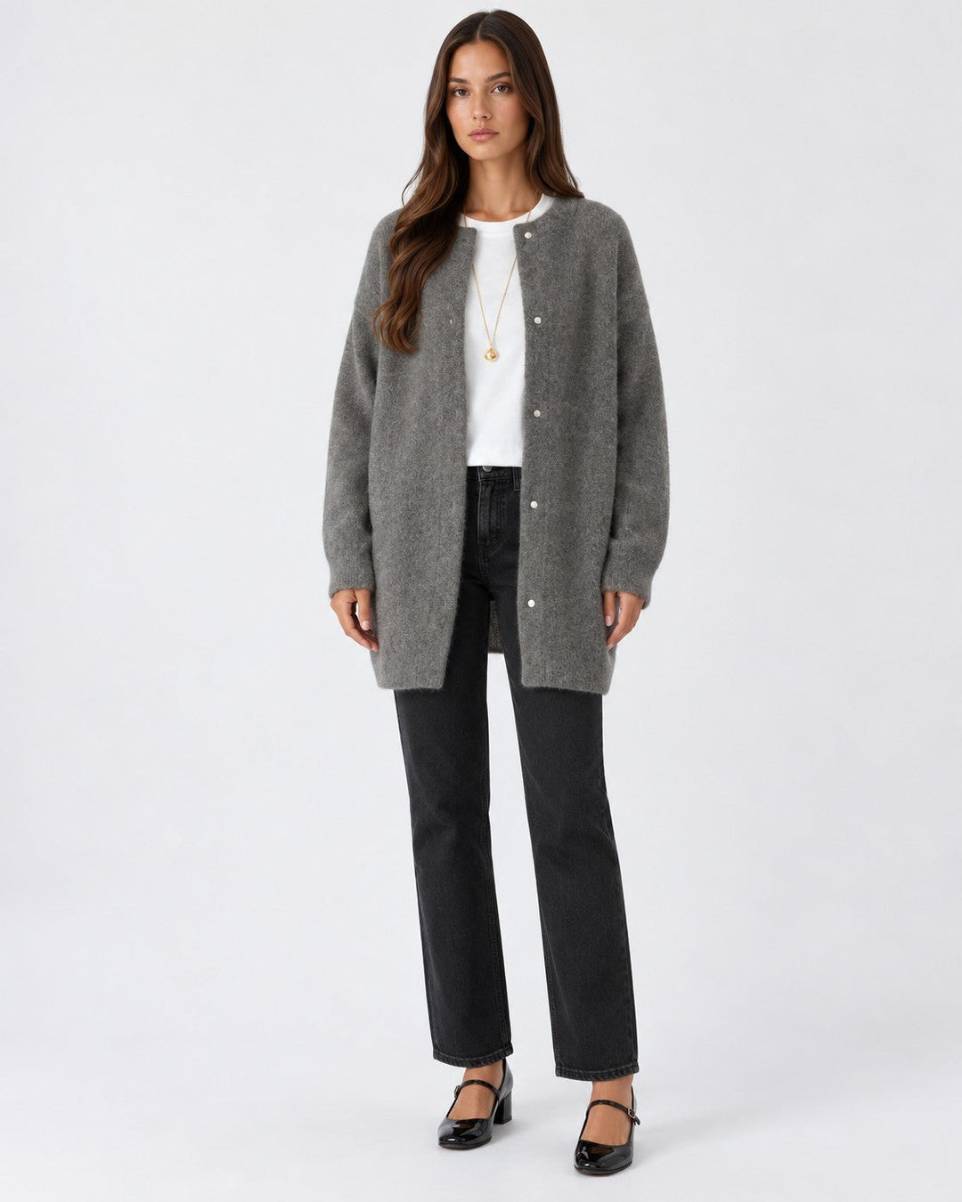 Luna Moda grey long knit cardigan with a relaxed fit worn by a model over a white t-shirt and black jeans