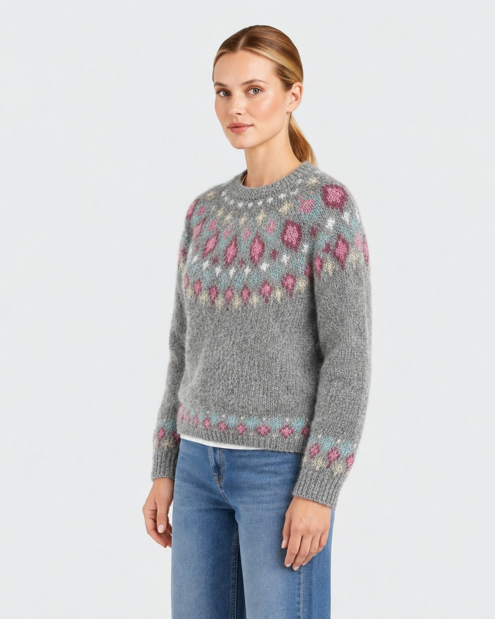 Luna Moda handmade grey wool sweater with a decorative pink and blue patterned yoke worn by a woman