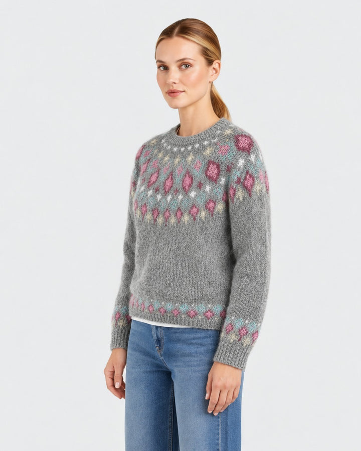 Luna Moda handmade grey wool sweater with a decorative pink and blue patterned yoke worn by a woman