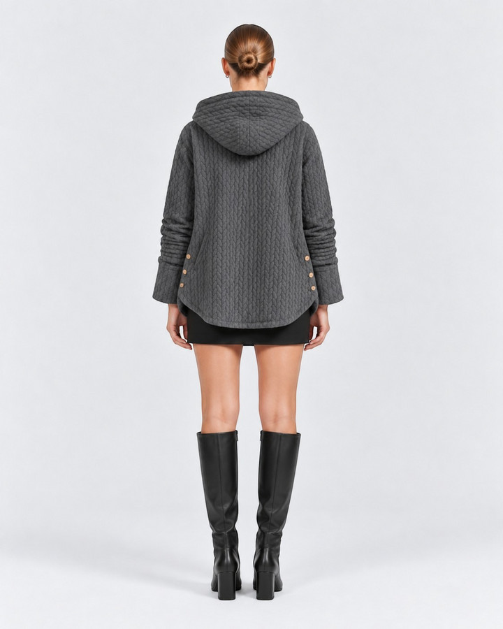 Luna Moda grey quilted hooded jacket with decorative side buttons worn by a model from the back view