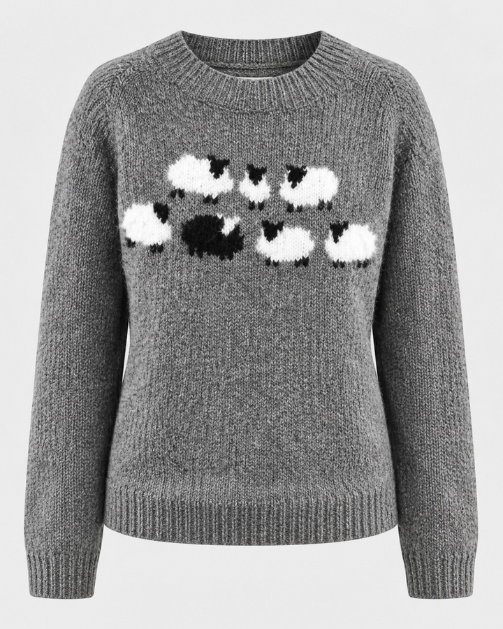 Luna Moda grey knitted sweater featuring a playful white and black sheep pattern with a ribbed crew neck and cuffs.
