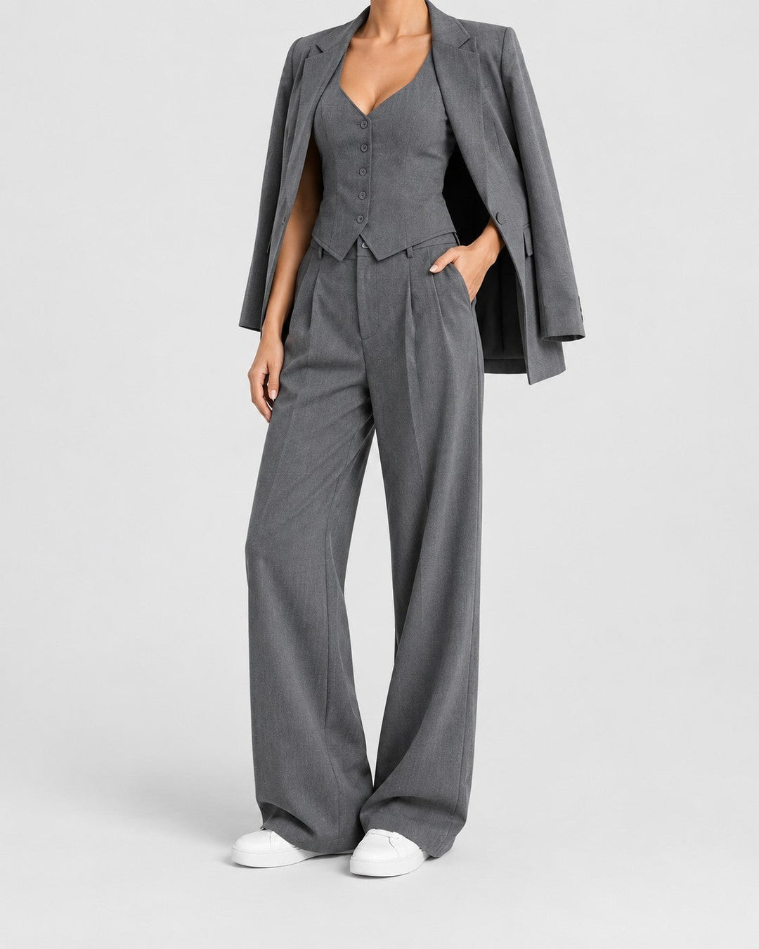 Luna Moda three-piece grey suit featuring a tailored blazer, button-up vest, and wide-leg trousers on a model.