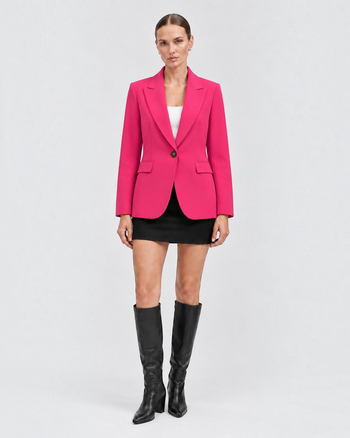 Luna Moda hot pink classic blazer worn by a model with a black mini skirt and knee-high boots