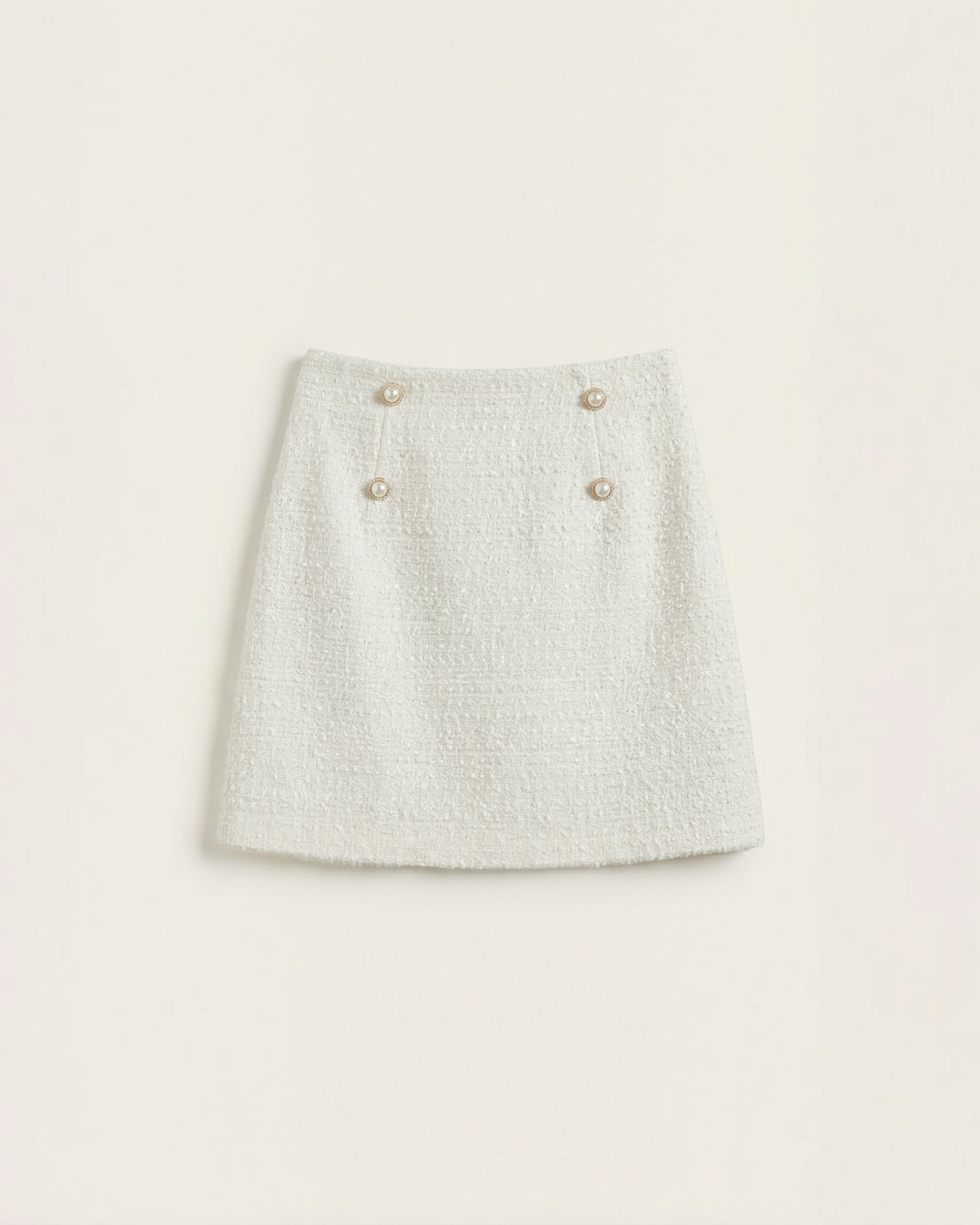 Luna Moda Isla white tweed mini skirt with metallic threads and decorative gold buttons in an A-line silhouette.