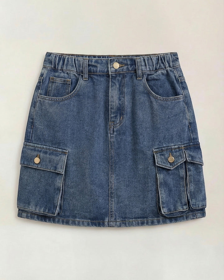 Luna Moda Ivy denim cargo mini skirt with an elastic waistband and functional side pockets in a medium blue wash.