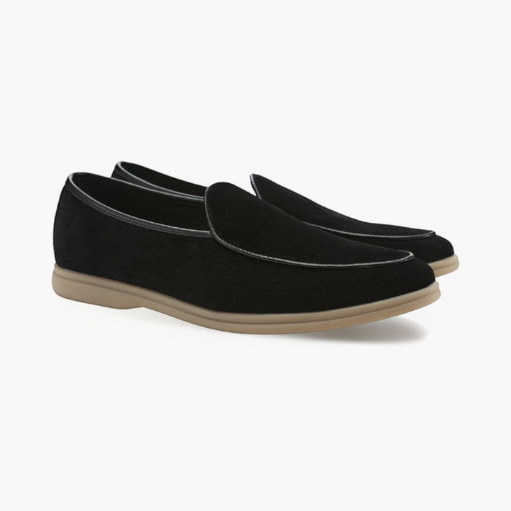 Luna Moda JOEL black full-grain leather loafers with a tapered toe, hand-stitched details, and a beige rubber sole.