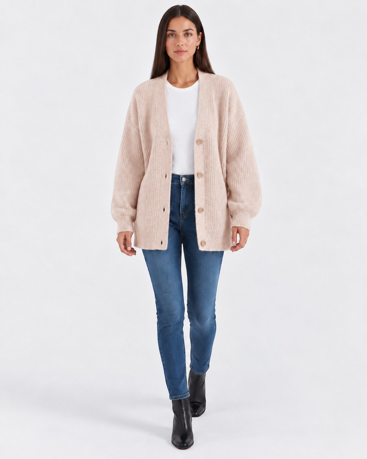 Luna Moda Laura beige cashmere V-neck cardigan worn by a model with blue jeans and black boots