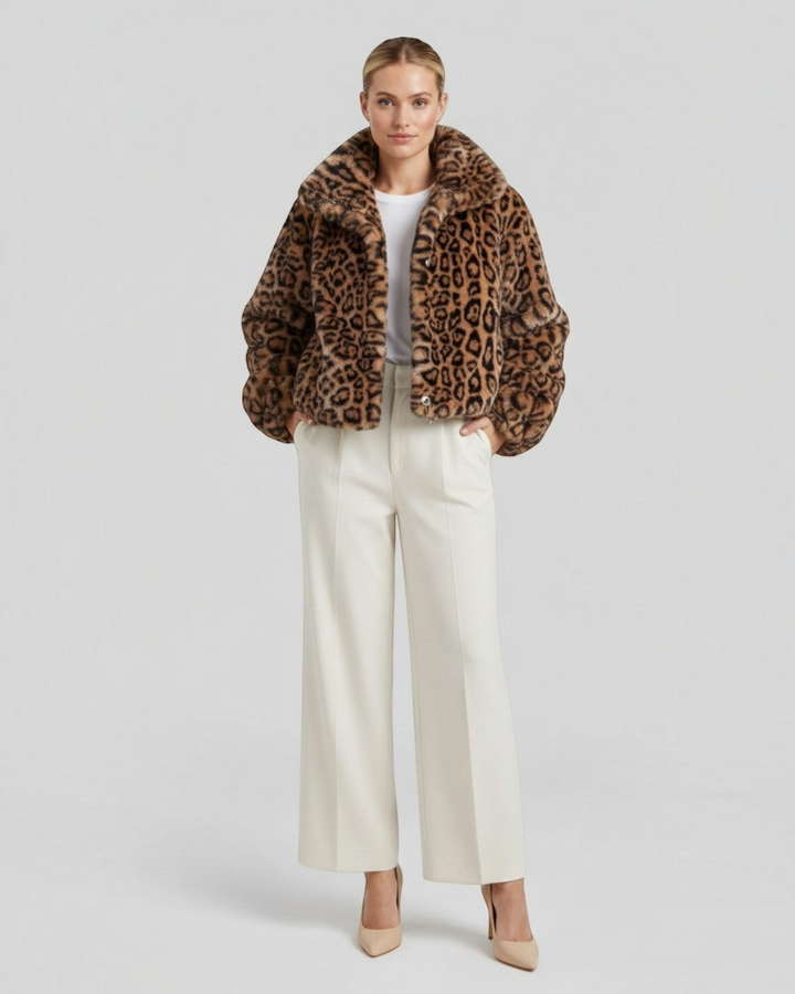 Luna Moda leopard print faux fur cropped coat worn by a model with white trousers and heels against a grey background