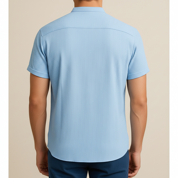 Back view of a Luna Moda light blue short-sleeved shirt with a textured ribbed fabric and relaxed fit.