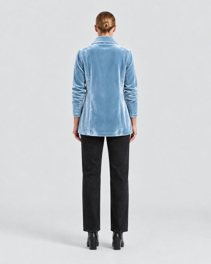 Back view of a woman wearing a Luna Moda light blue velvet blazer with long sleeves and a tailored fit.