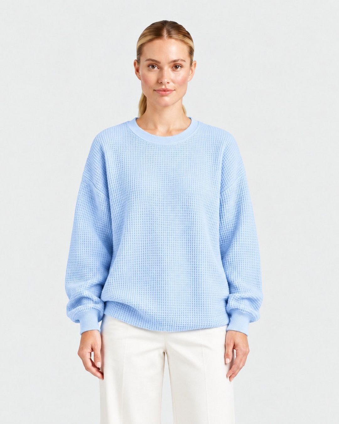 Luna Moda light blue waffle knit oversized sweater with a crew neckline worn by a model against a white background
