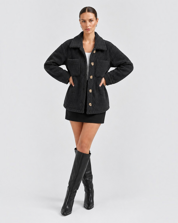 Luna Moda Liliana black textured fleece jacket with lapel collar, button front, and chest pockets on a model