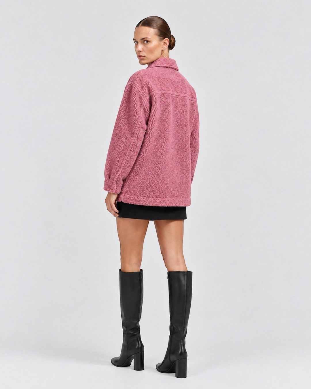 Luna Moda Liliana pink textured fleece jacket with a collar, worn by a model with a black skirt and tall boots.