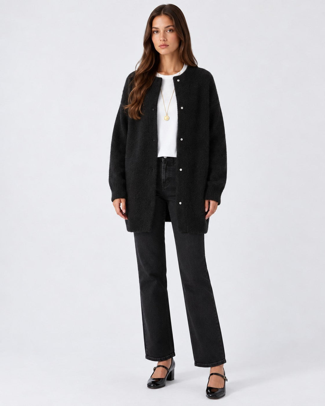 Luna Moda long black knit cardigan worn by a model with a white t-shirt and black jeans for a relaxed elegant look