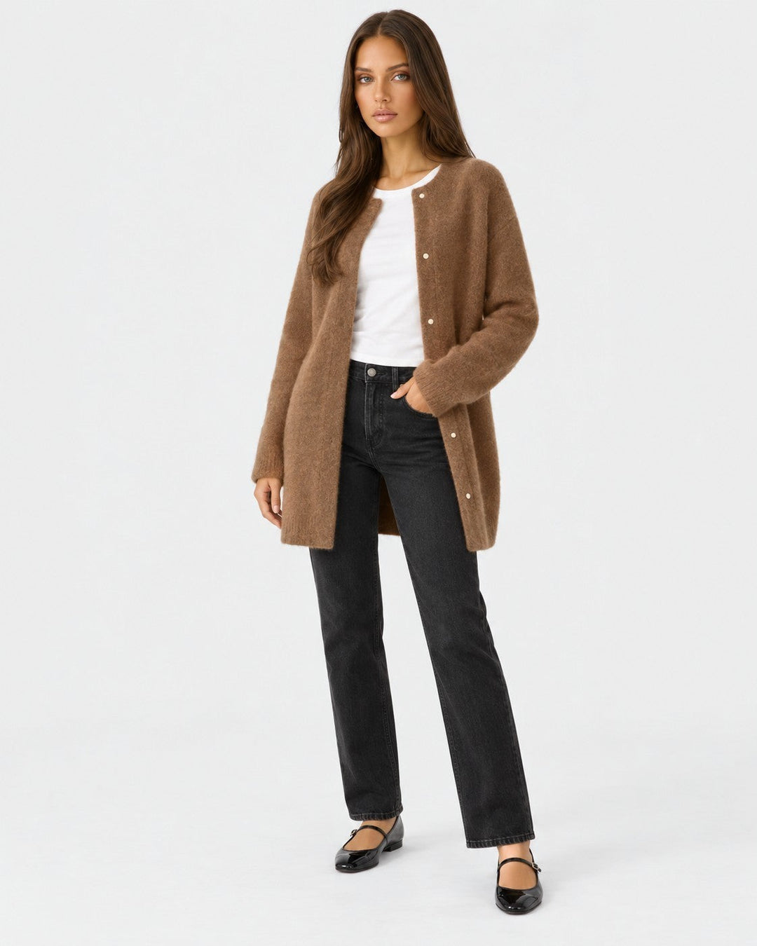 Luna Moda long brown knit cardigan worn by a model with a white t-shirt, black jeans, and black ballet flats.