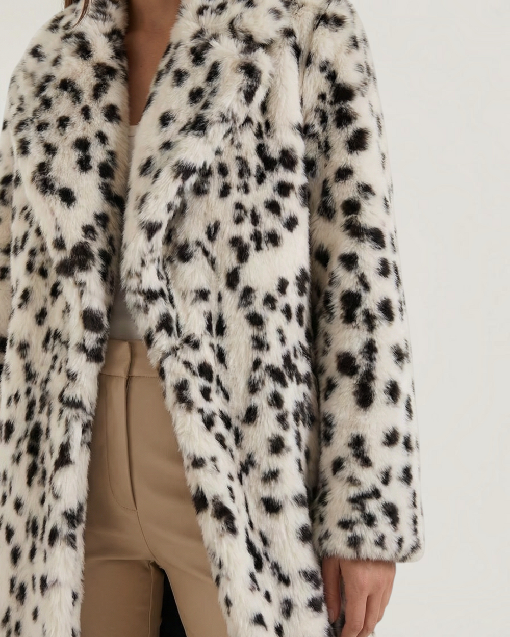 Luna Moda Morgana faux fur coat with a black and white leopard print, oversized collar, and long relaxed silhouette.