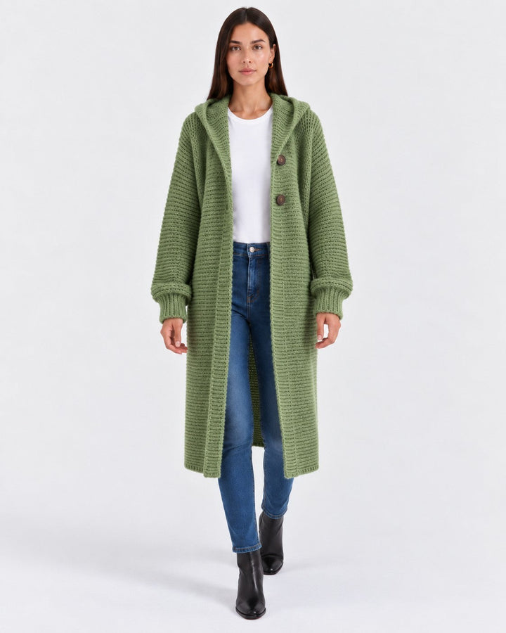Luna Moda long olive green knit cardigan with a hood and front buttons worn by a model with jeans and boots