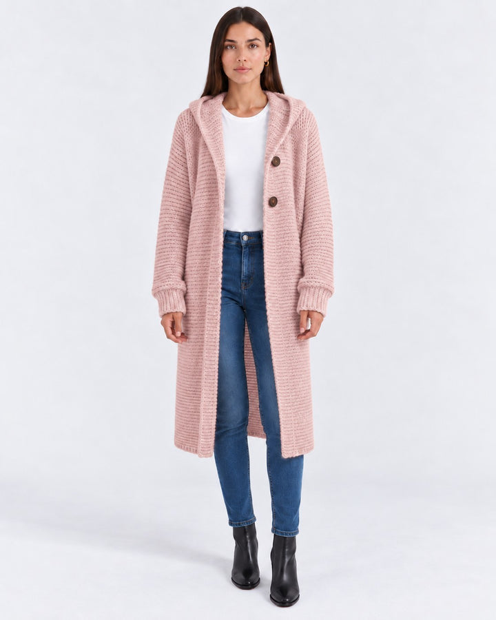 Luna Moda long pink hooded knit cardigan worn by a model with blue jeans and black boots