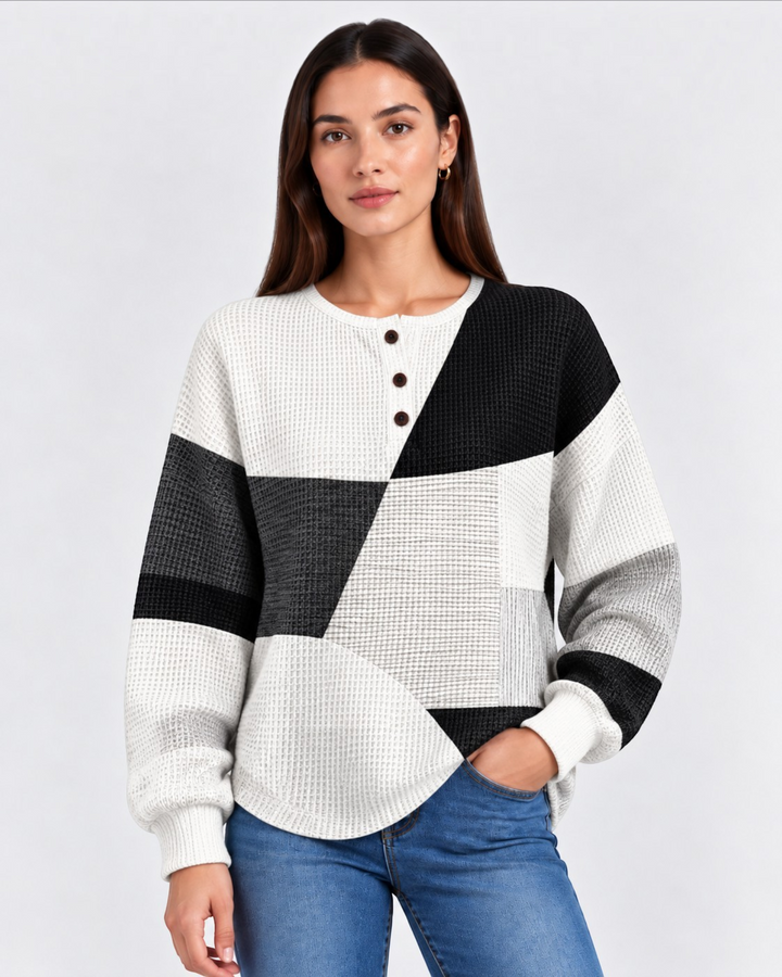 Luna Moda Marcella waffle knit Henley sweater featuring a black, white, and grey geometric color-block pattern.