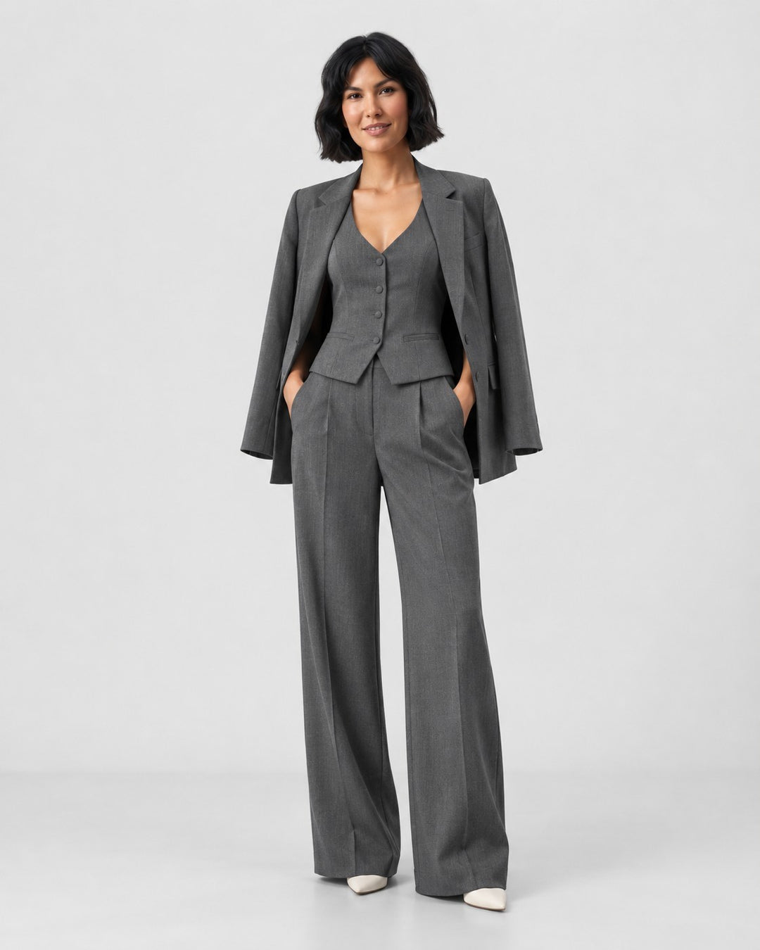 Luna Moda Marcella 3-piece grey tailored suit featuring a blazer, buttoned vest, and wide-leg trousers on a model.