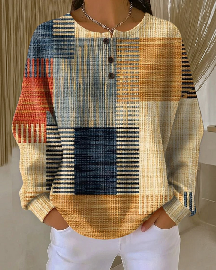 Luna Moda Marcella waffle knit Henley sweater featuring a multi-colored block pattern in warm autumn tones.