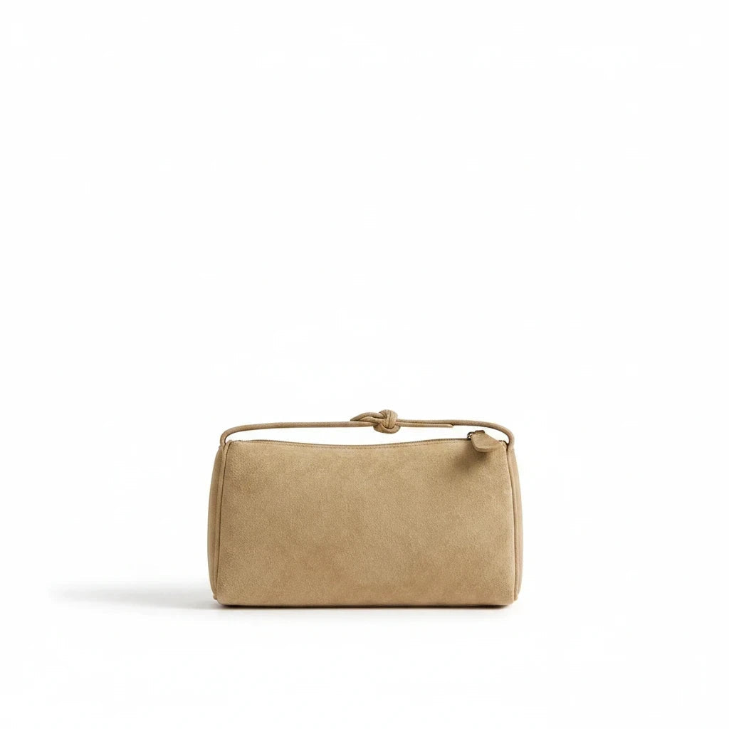 Luna Moda Marisa beige suede shoulder bag with a knotted strap detail on a clean white background.