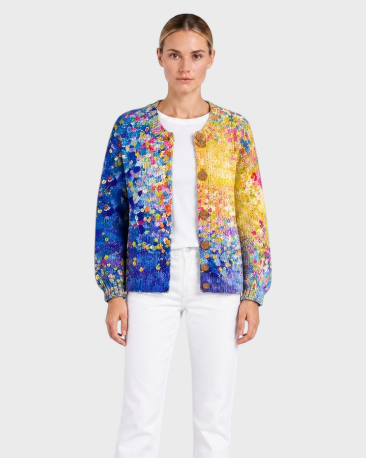 Luna Moda Marta cardigan featuring a vibrant floral patchwork design, soft padded fabric, and rustic wooden buttons.