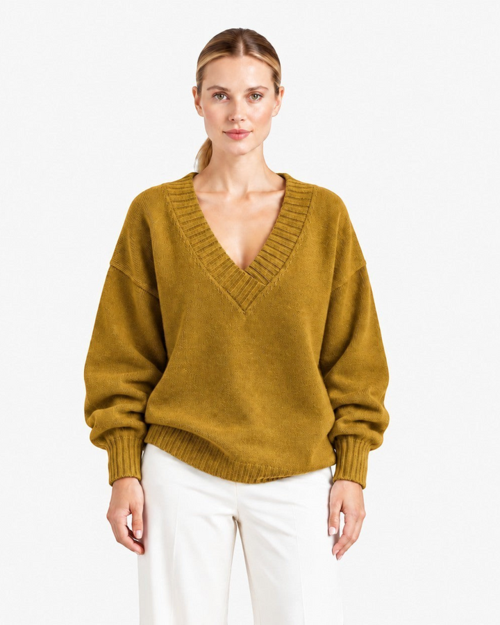 Luna Moda Nadia relaxed fit mustard yellow cashmere blend sweater with a deep V-neck and long sleeves on a model.