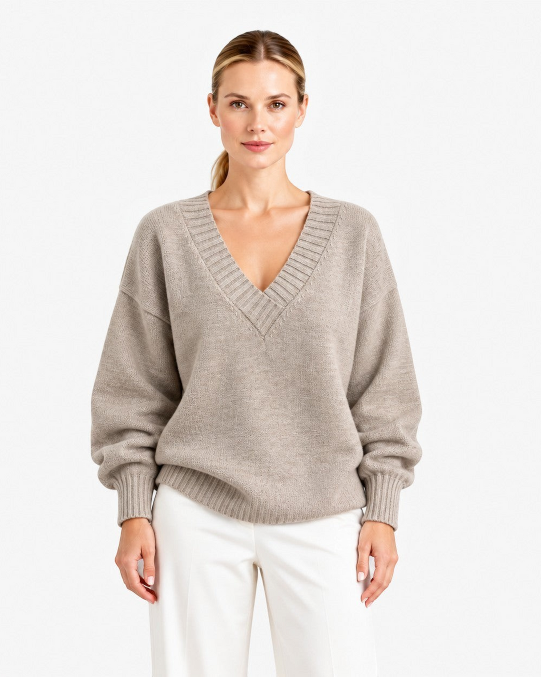 Luna Moda Nadia beige cashmere blend sweater with deep V-neck and relaxed fit worn by a woman