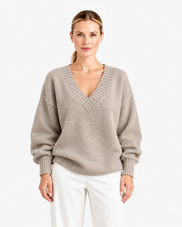 Luna Moda Nadia beige cashmere blend sweater with deep V-neck and relaxed fit worn by a woman