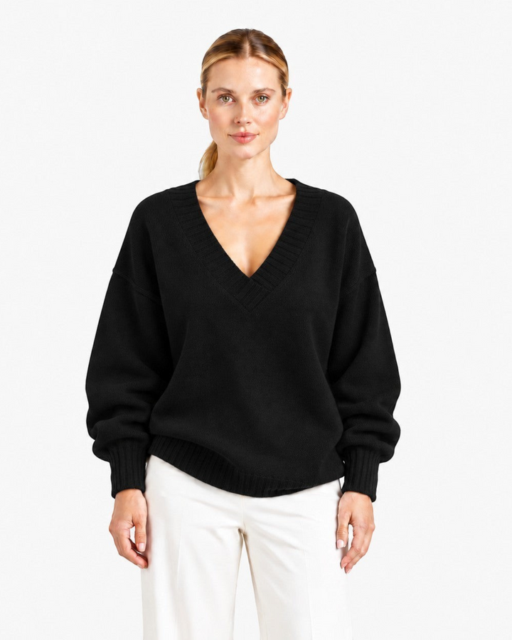 Luna Moda Nadia black relaxed fit cashmere blend sweater with a deep V-neck worn by a model.