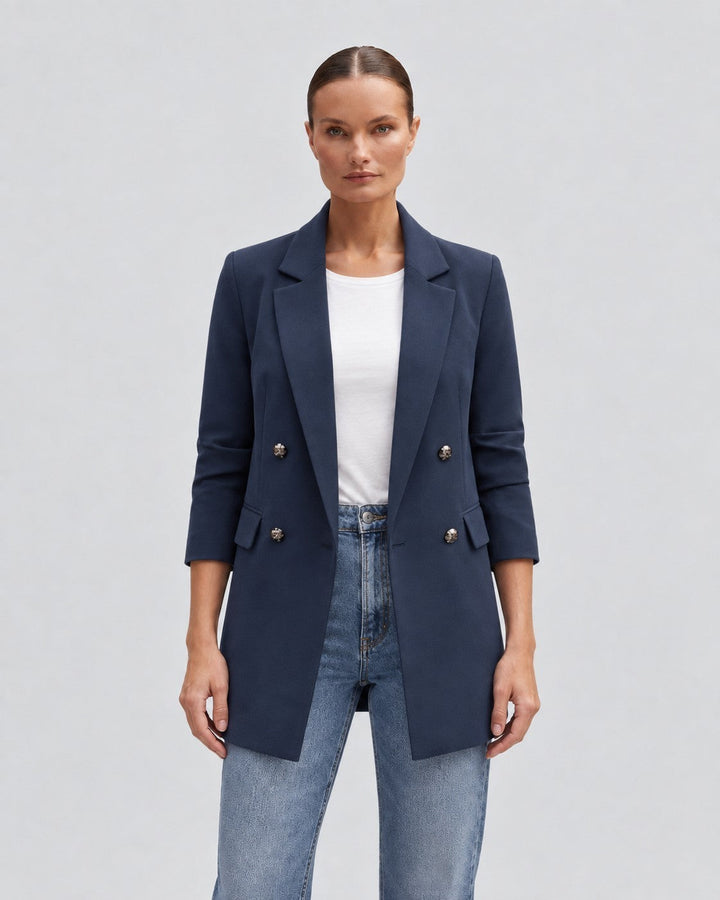 Luna Moda navy blue double-breasted blazer worn by a woman with a white t-shirt and jeans, elegant tailored style.
