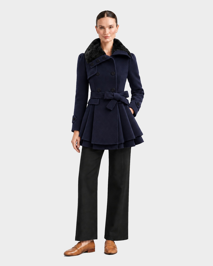 Luna Moda navy blue flared winter coat with a faux fur collar and belted waist worn by a model.