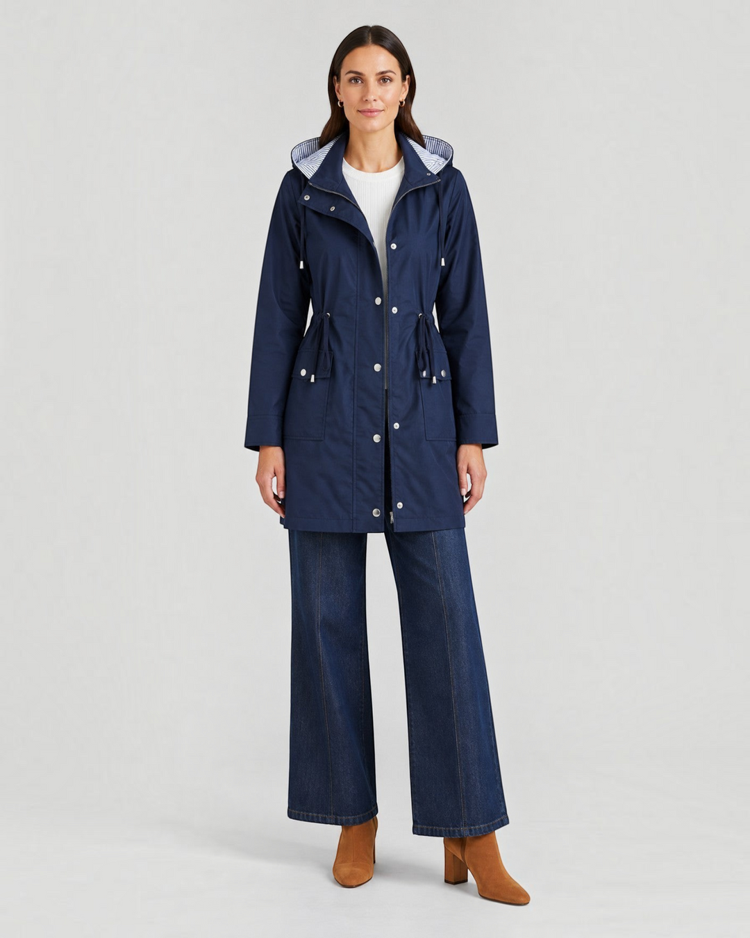 Luna Moda navy blue lightweight hooded jacket with adjustable waist and striped lining worn by a female model