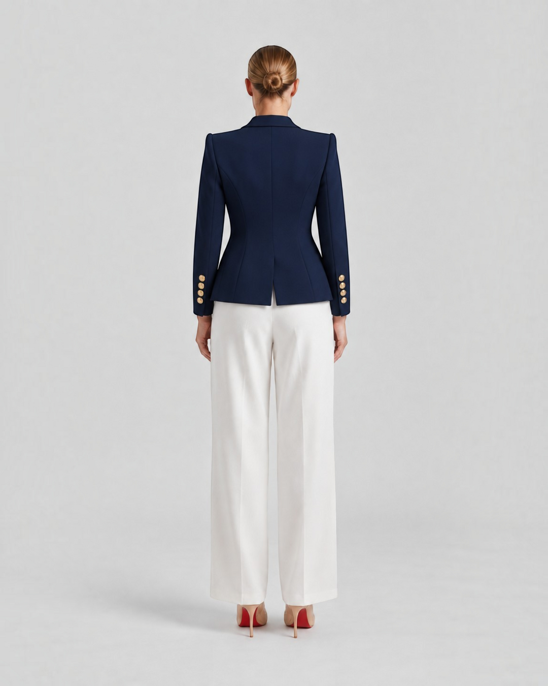 Luna Moda Paolina navy structured blazer with gold buttons worn with white trousers, back view