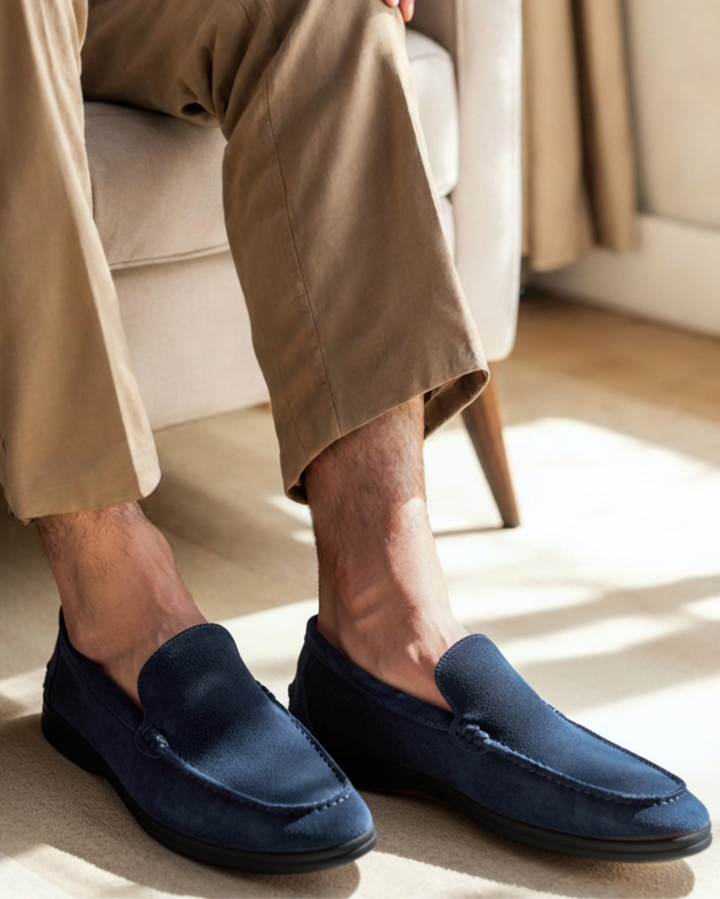 Luna Moda premium navy blue suede loafers with a black contrast sole worn with beige trousers in a casual setting