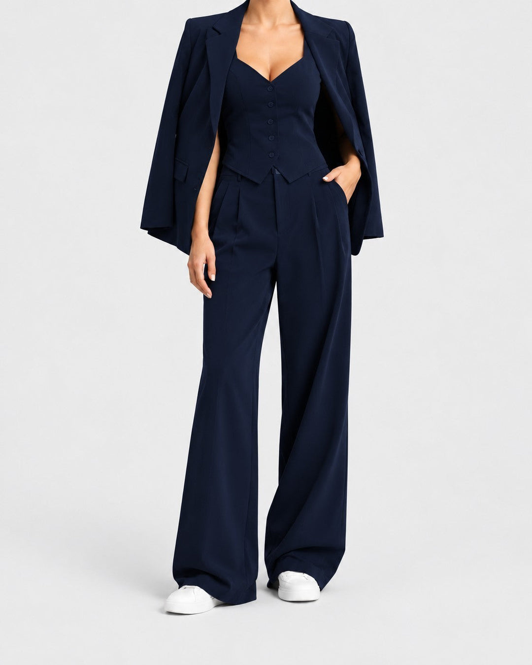 Luna Moda navy blue three-piece suit featuring a tailored blazer, button-up vest, and wide-leg trousers on a model.