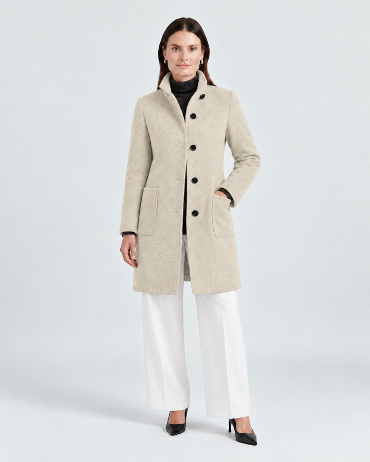 Luna Moda NELLA beige high-neck wool-blend coat worn by a model with white trousers and black heels