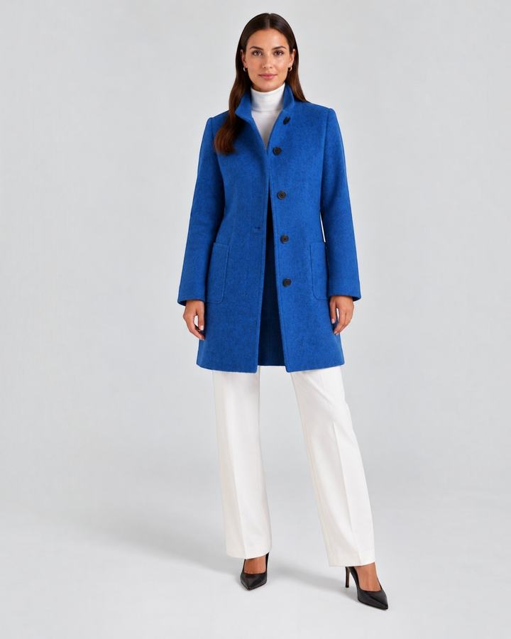 Luna Moda NELLA high-neck blue wool-blend coat worn by a model with white trousers and black heels