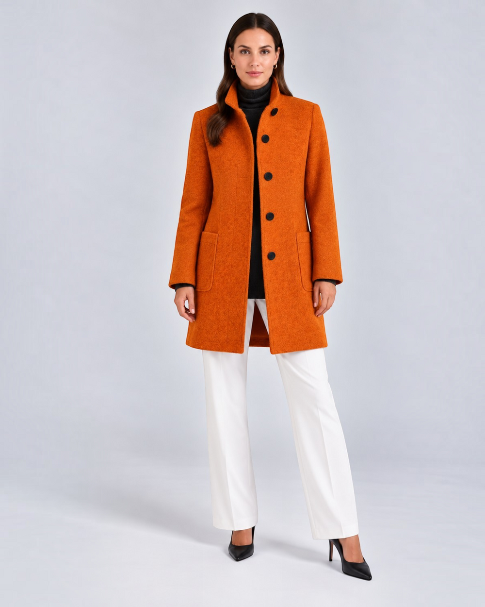 Luna Moda NELLA burnt orange high neck wool-blend coat worn by a model with white trousers and black heels