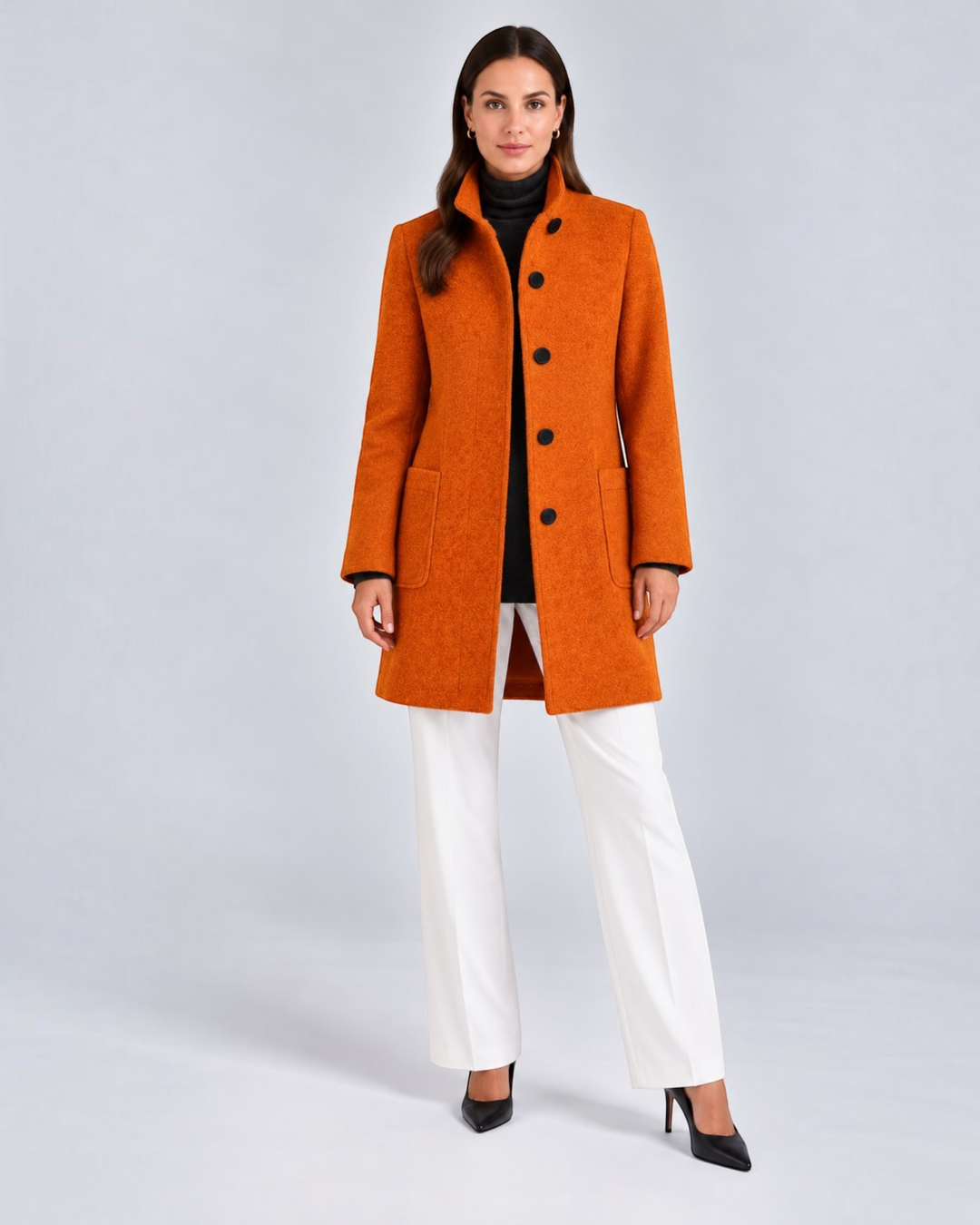 Luna Moda NELLA burnt orange high neck wool-blend coat worn by a model with white trousers and black heels