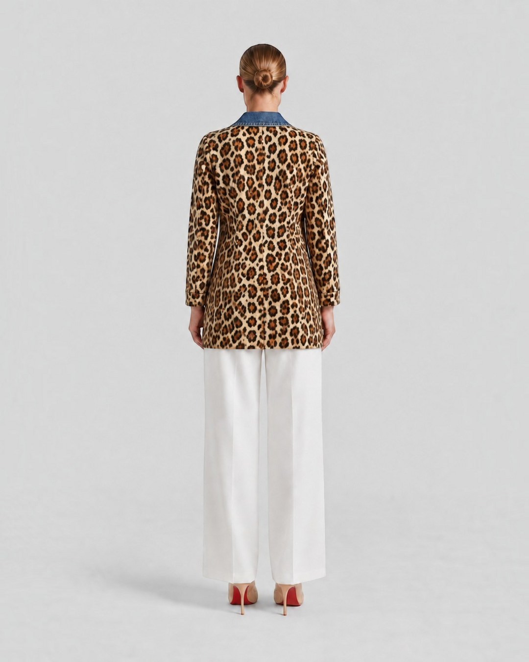Luna Moda Nora long jacket with leopard print body and blue denim collar, back view on a model wearing white trousers