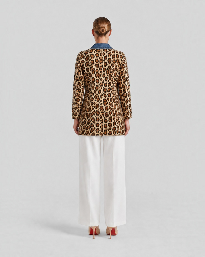 Luna Moda Nora long jacket with leopard print body and blue denim collar, back view on a model wearing white trousers