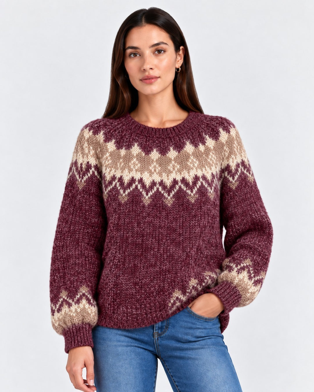 Luna Moda handmade knit sweater in burgundy and beige with a Nordic pattern, worn by a model with blue jeans.