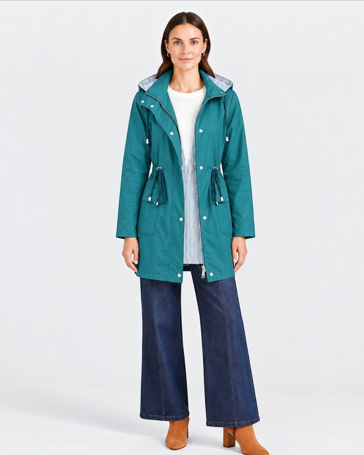 Luna Moda Olimpia lightweight teal jacket with adjustable waist, hood, and striped lining worn by a female model