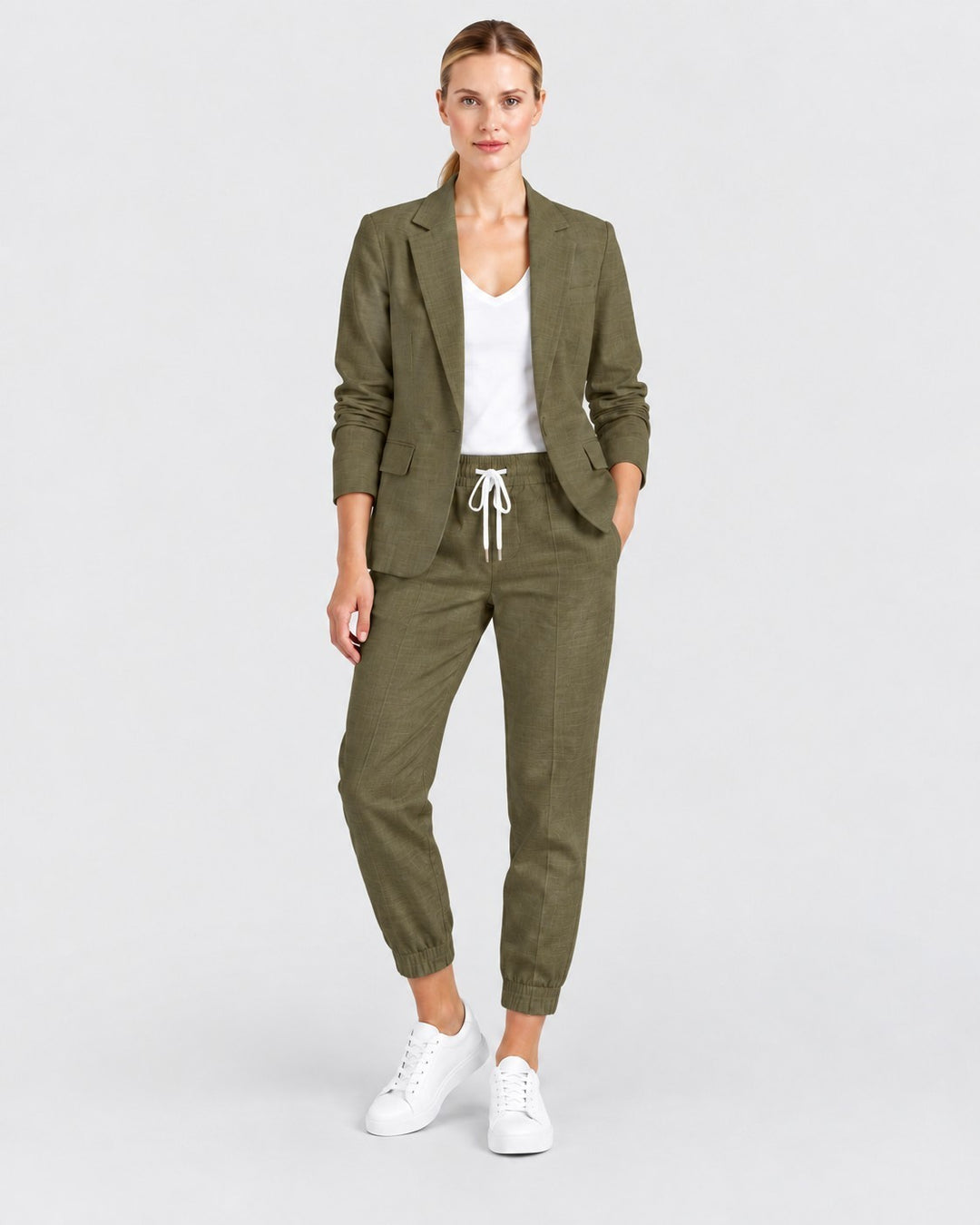 Luna Moda olive green lightweight blazer and jogger pants set worn by a woman with white sneakers