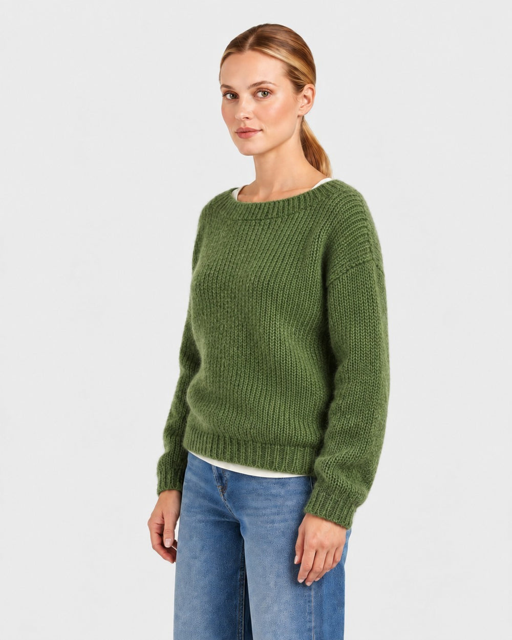 Luna Moda Elda crew neck sweater in olive green, featuring a soft chunky knit texture worn by a woman with jeans.