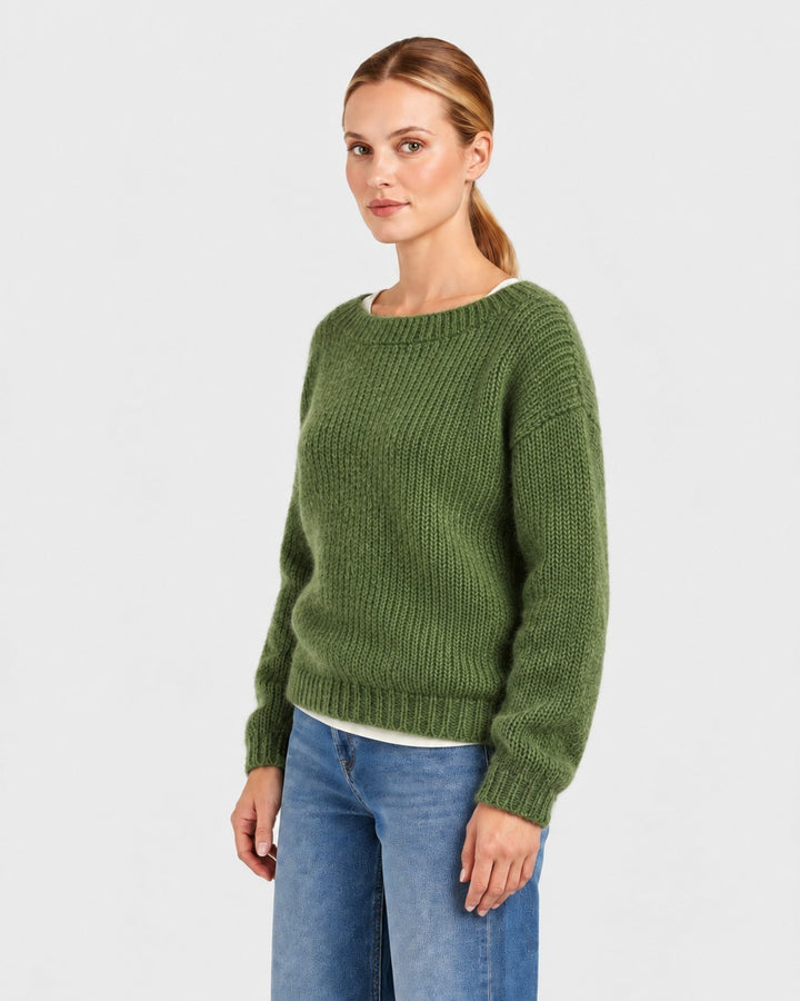 Luna Moda Elda crew neck sweater in olive green, featuring a soft chunky knit texture worn by a woman with jeans.